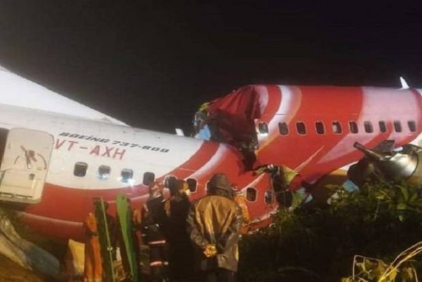 Air India Express flight carrying 191 people split in two after skidding on landing at Kozhikode airport in Kerala, India